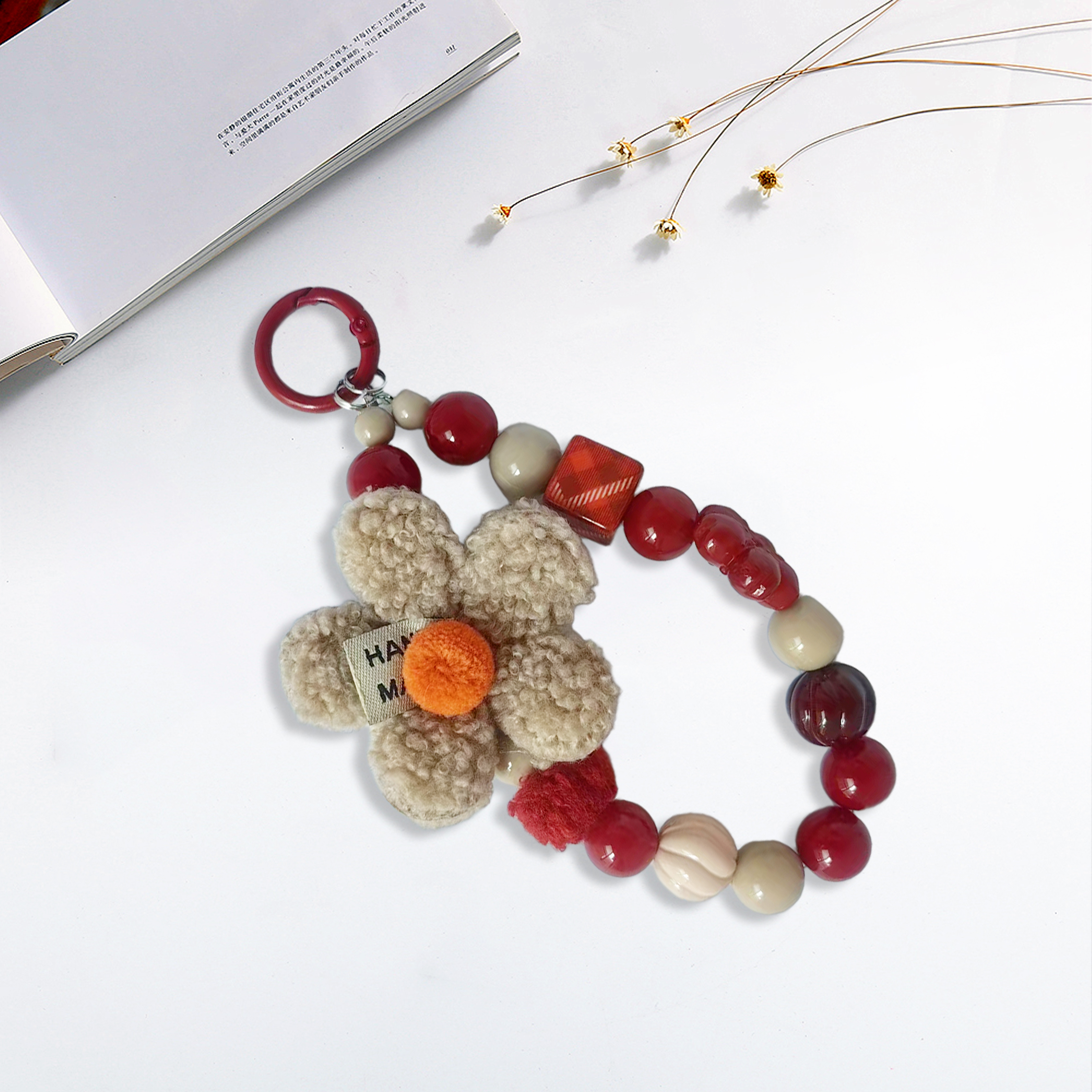 Plush flowers with red and white beads in a creative mix-and-match design. Multiple bead styles combine for a versatile. Anti-loss feature ensures eas