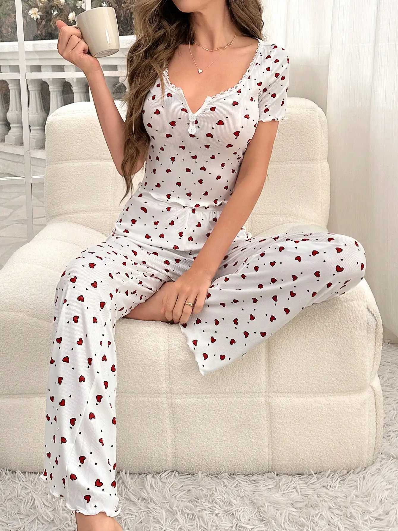 Comfortable pajama set featuring a heartshaped printed short sleeved top and elastic waistband with lotus edges suitable forT251014