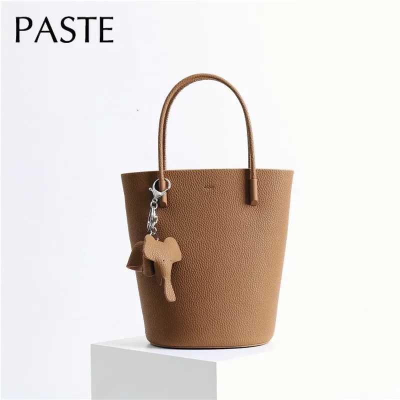 2024 Most Popar Togo Cowhide Leather Bucket Bag Small Neat Allmah Elegant Wen Shoder Bag with Elephant Ornaments D251014