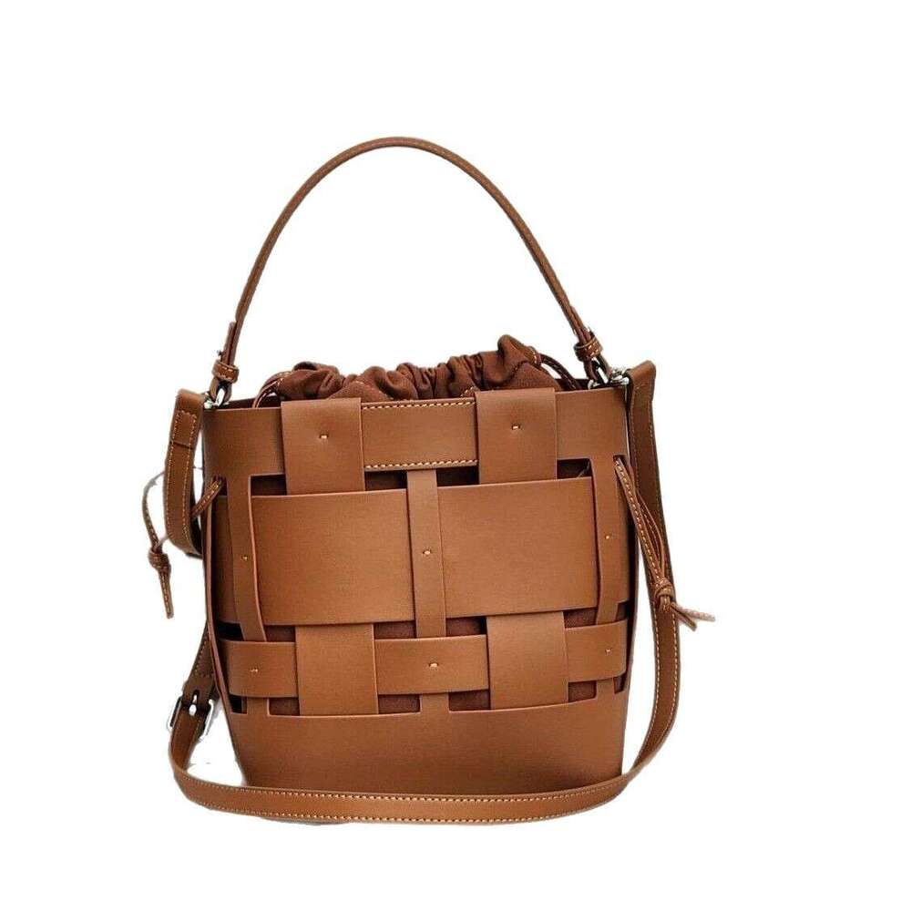 Luxury bag New Handwoven Bucket Niche Design Cowhide Hollow Casual Handheld Shoulder Crossbody Women s Bag