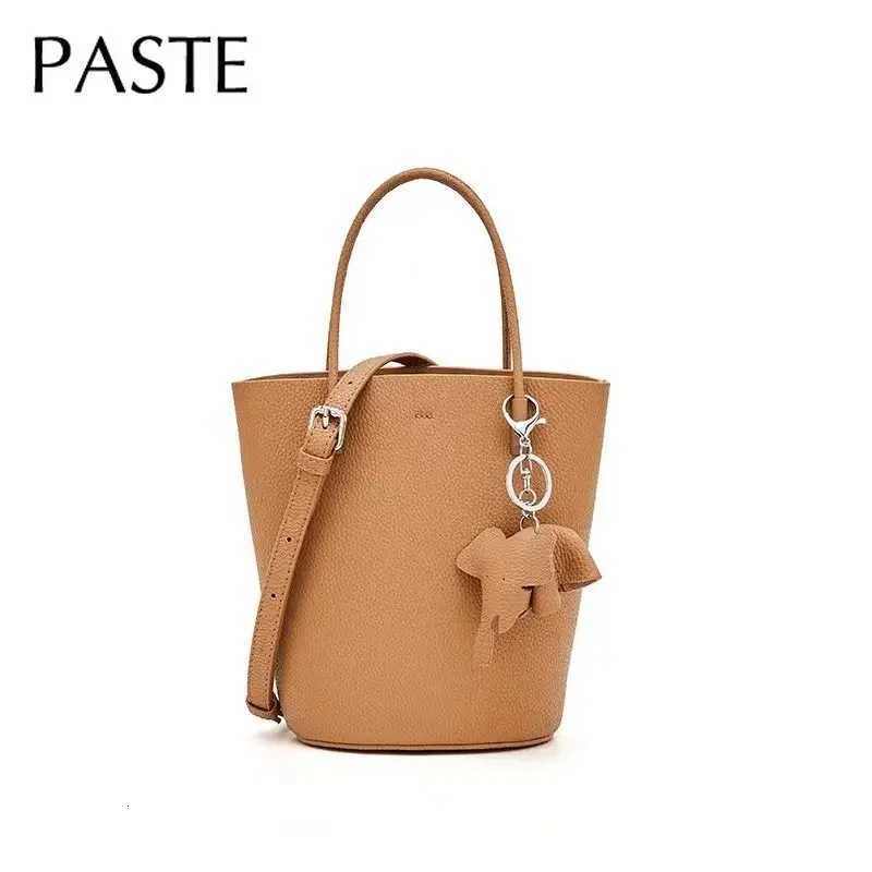 2024 Most Popar Togo Cowhide Leather Bucket Bag Small Neat Allmah Elegant Wen Shoder Bag with Elephant Ornaments D251014