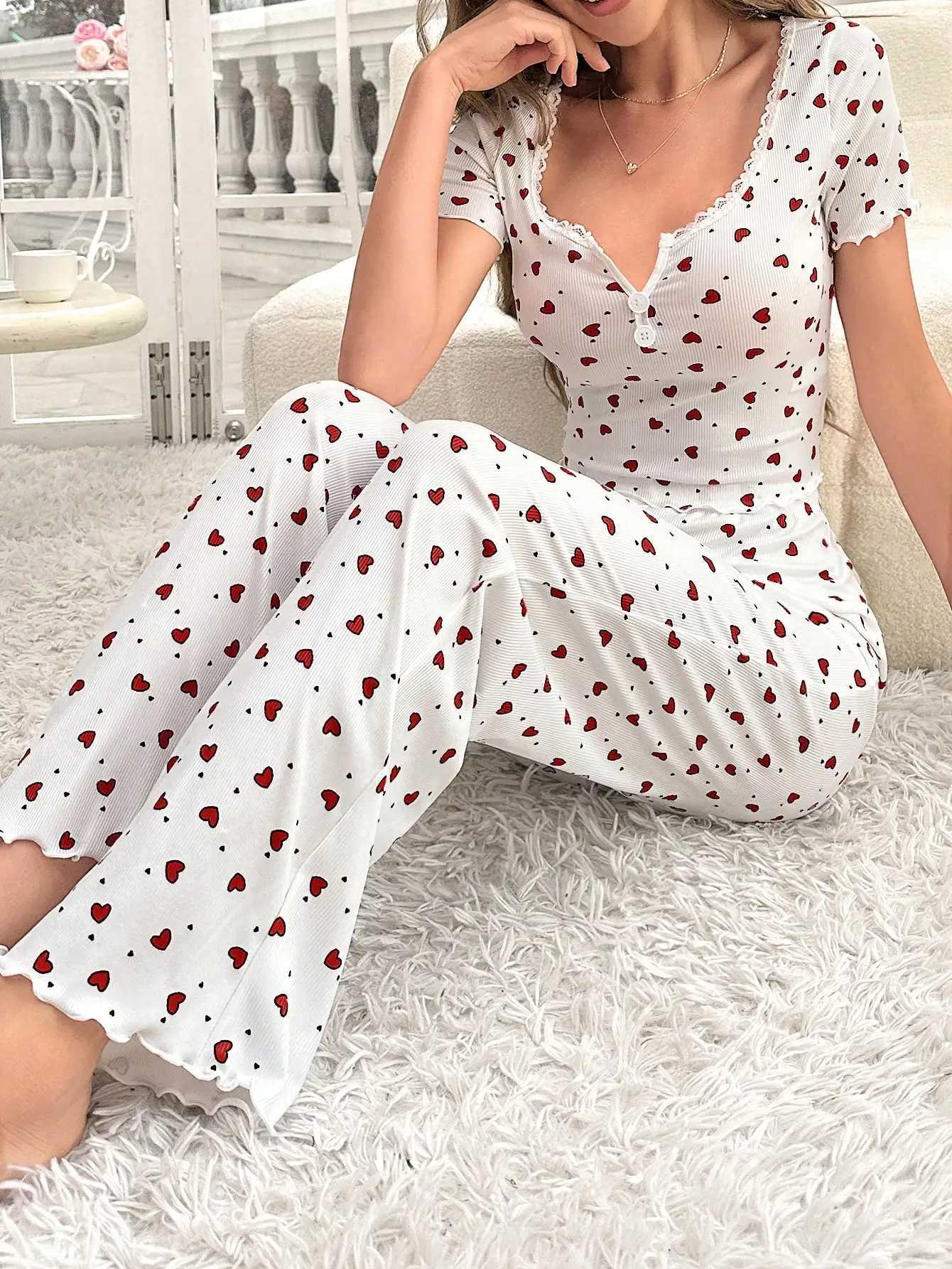 Comfortable pajama set featuring a heartshaped printed short sleeved top and elastic waistband with lotus edges suitable forT251014