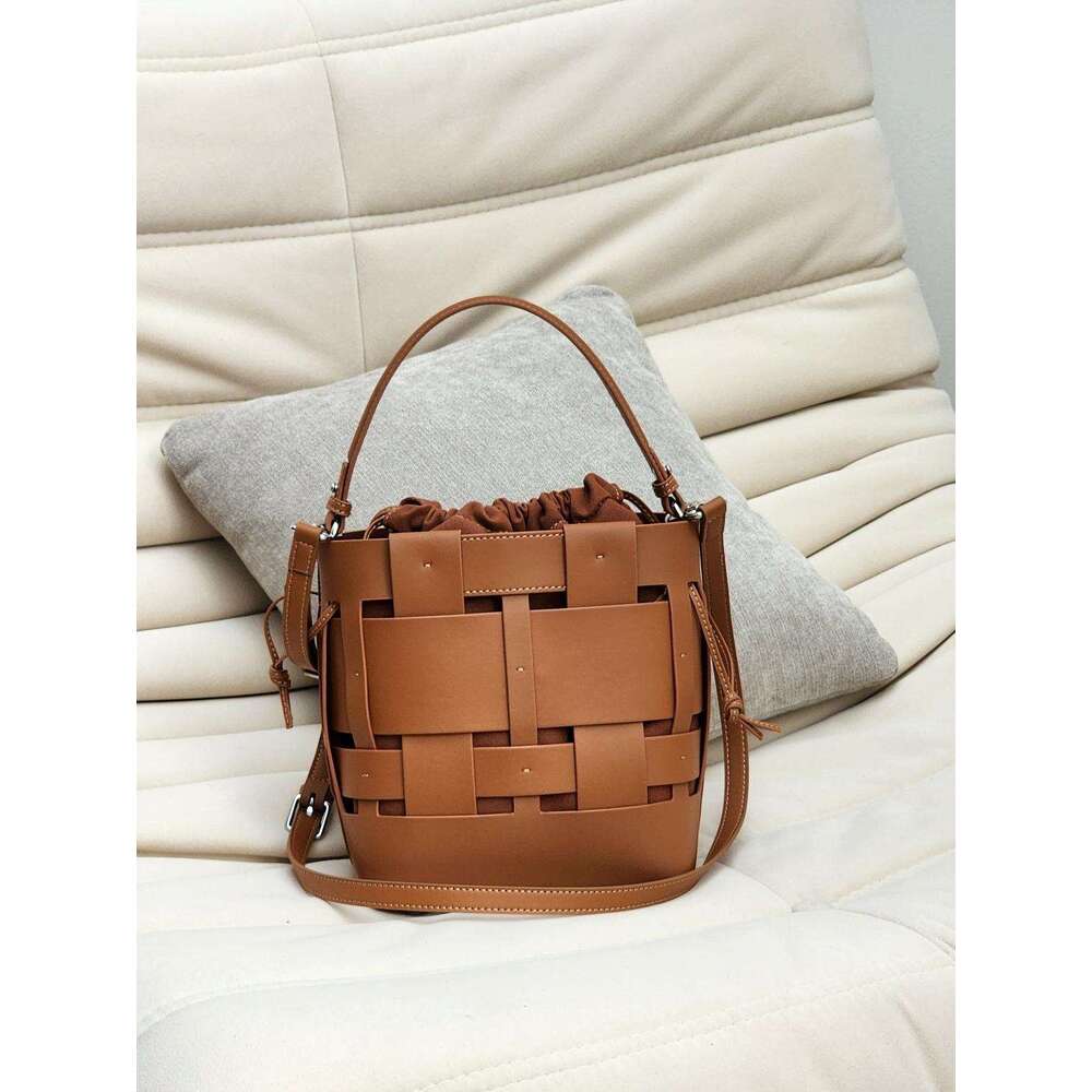 Luxury bag New Handwoven Bucket Niche Design Cowhide Hollow Casual Handheld Shoulder Crossbody Women s Bag