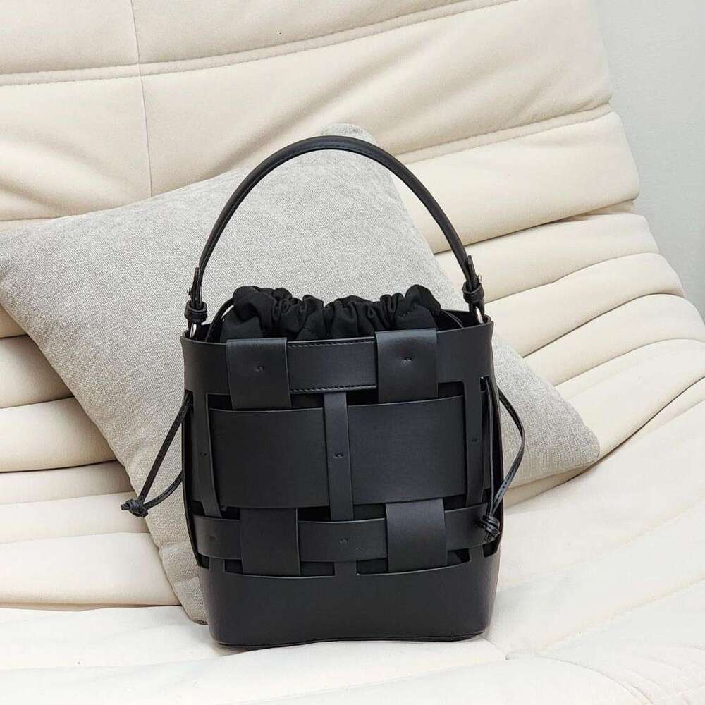 Luxury bag New Handwoven Bucket Niche Design Cowhide Hollow Casual Handheld Shoulder Crossbody Women s Bag