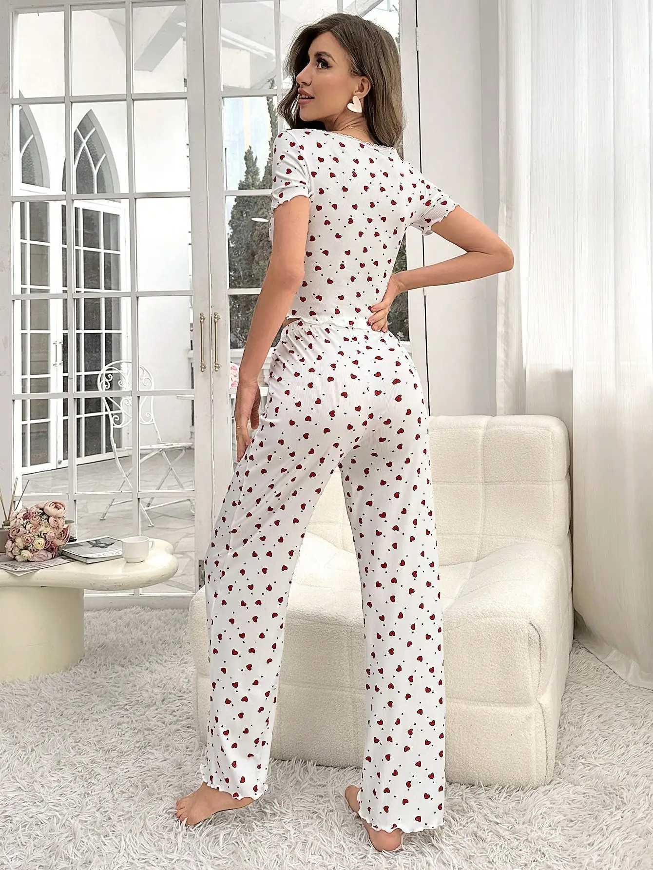 Comfortable pajama set featuring a heartshaped printed short sleeved top and elastic waistband with lotus edges suitable forT251014