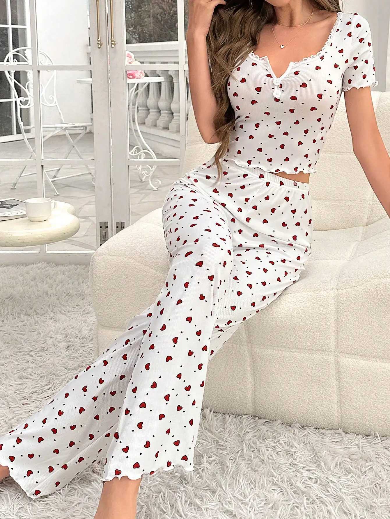 Comfortable pajama set featuring a heartshaped printed short sleeved top and elastic waistband with lotus edges suitable forT251014