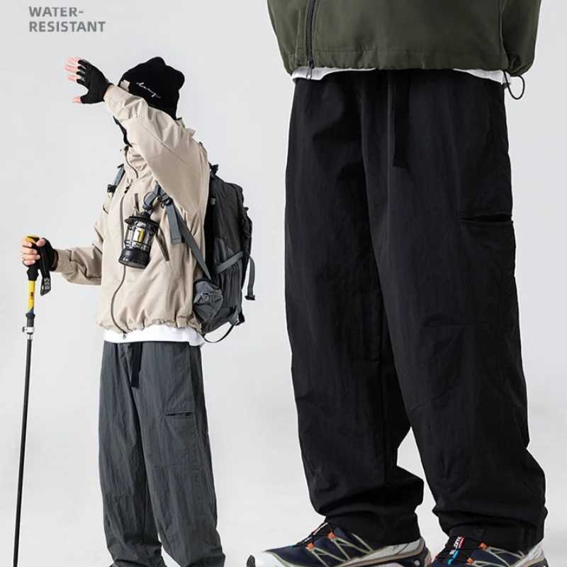 2025 New Japanese outdoor functional casual pants for men in spring with anti splash side pockets and loose workwear pants J251203