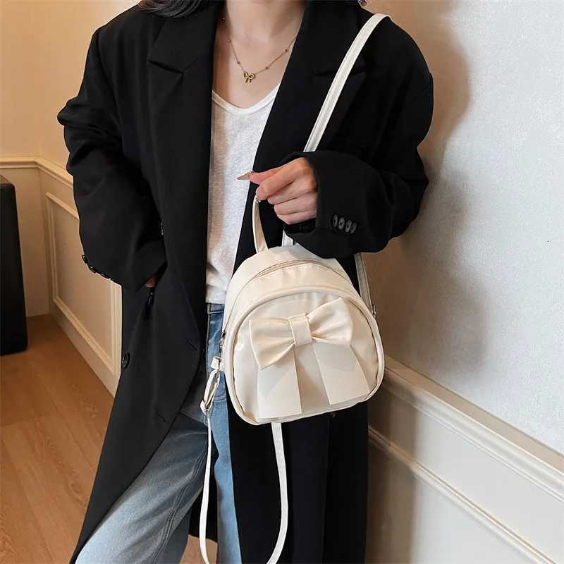 Summer 2025 new niche bow backpack for women stylish and simple handheld shoulder crossbody backpackT251016