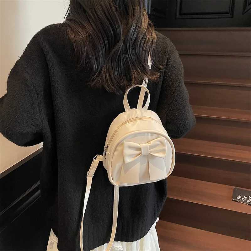 Summer 2025 new niche bow backpack for women stylish and simple handheld shoulder crossbody backpackT251016