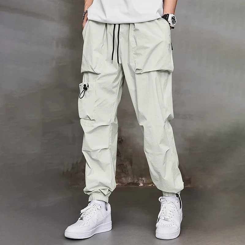Mens work pants fashion brand Spring and Autumn new multi pocket American sports pants wrapped leg pants mens casual pants J251203