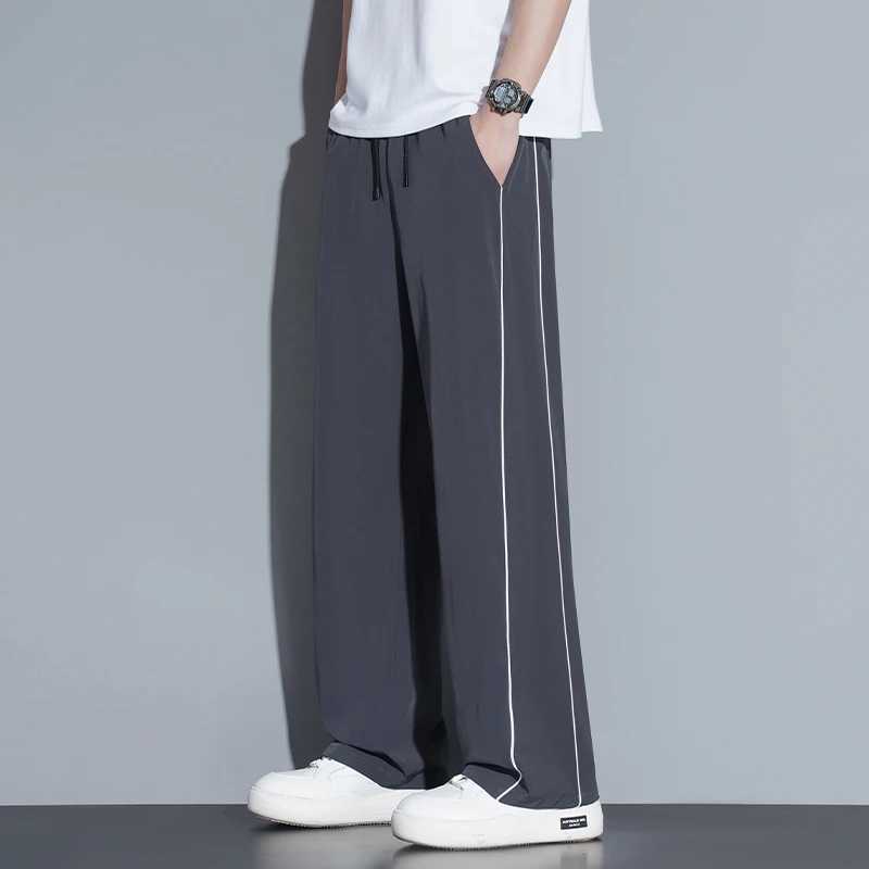 Summer ice silk thin section pants mens Hong Kong style loose splicing casual sports widelegged pants elastic speed pants J251203