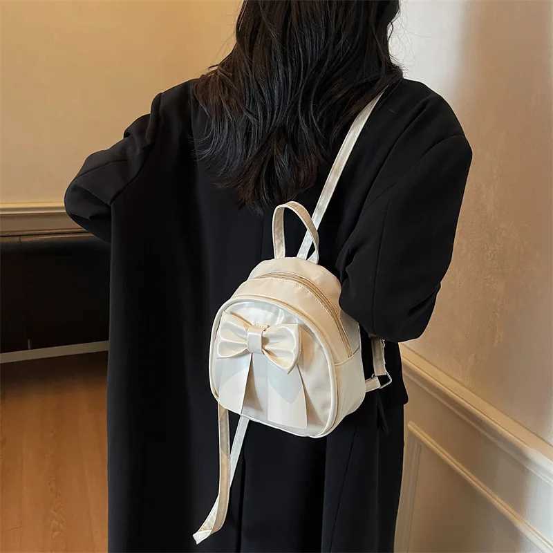 Summer 2025 new niche bow backpack for women stylish and simple handheld shoulder crossbody backpackT251016