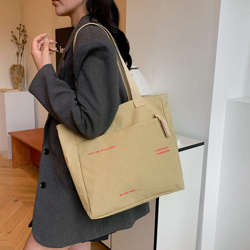 2025 New Commuting Large Capacity Single Shoulder Canvas for Women Korean Version Versatile Handheld Tote Bag