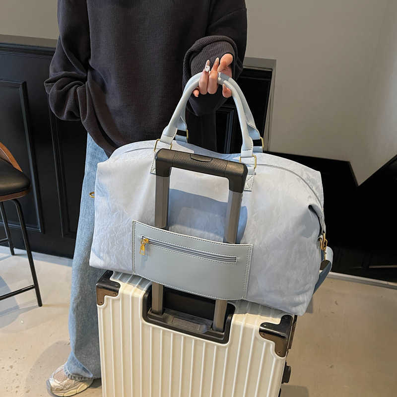 2025 New Simple Multifunctional Storage Travel Handbag for Girls Large Capacity Carry-on Luggage Bag 250415