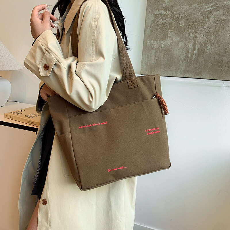 2025 New Commuting Large Capacity Single Shoulder Canvas for Women Korean Version Versatile Handheld Tote Bag