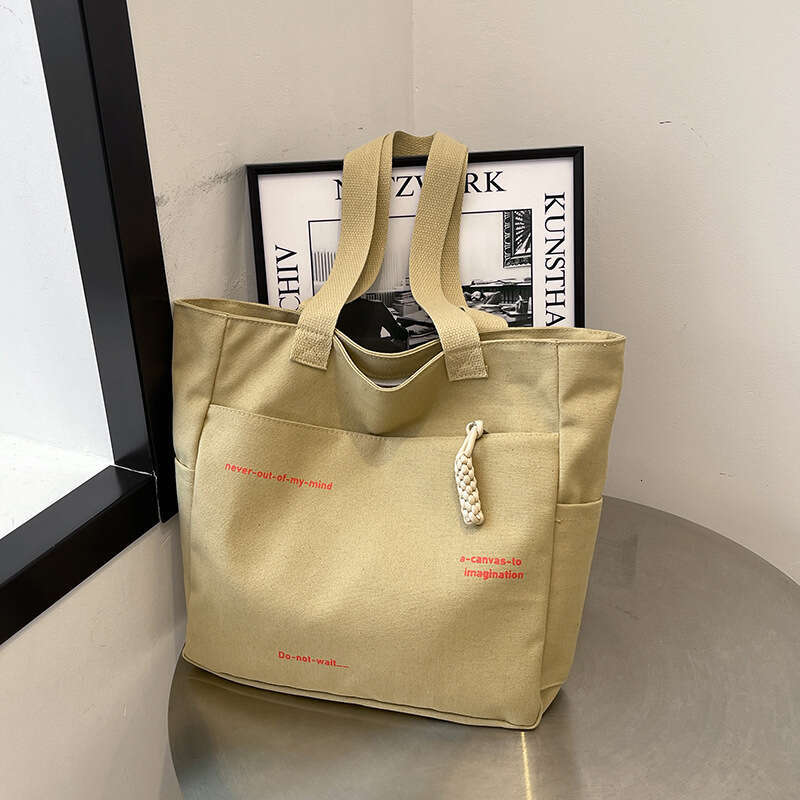 2025 New Commuting Large Capacity Single Shoulder Canvas for Women Korean Version Versatile Handheld Tote Bag