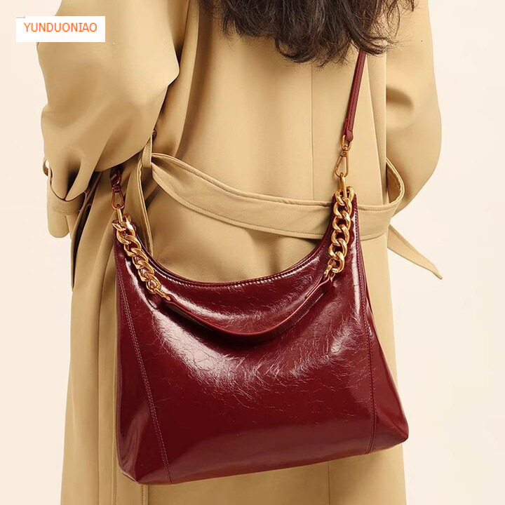 Autumn and winter new minimalist style designer bag new glossy leather red women's shoulder bag fashion trend luxury handbag
