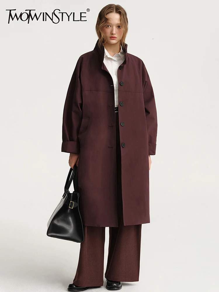 TWOTWINSTYLE Solid Casual Trench For Women Stand Collar Long Sleeve Patchwork Single Breasted Temperament Long Coats Female 251013