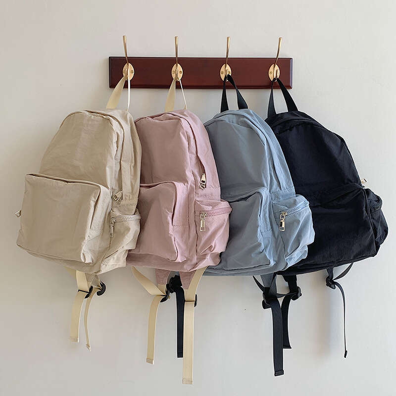 Korean Casual Lightweight Commuter Large Capacity Harajuku Style Backpack Solid Color Simple Student Nylon Cloth School Bag B5