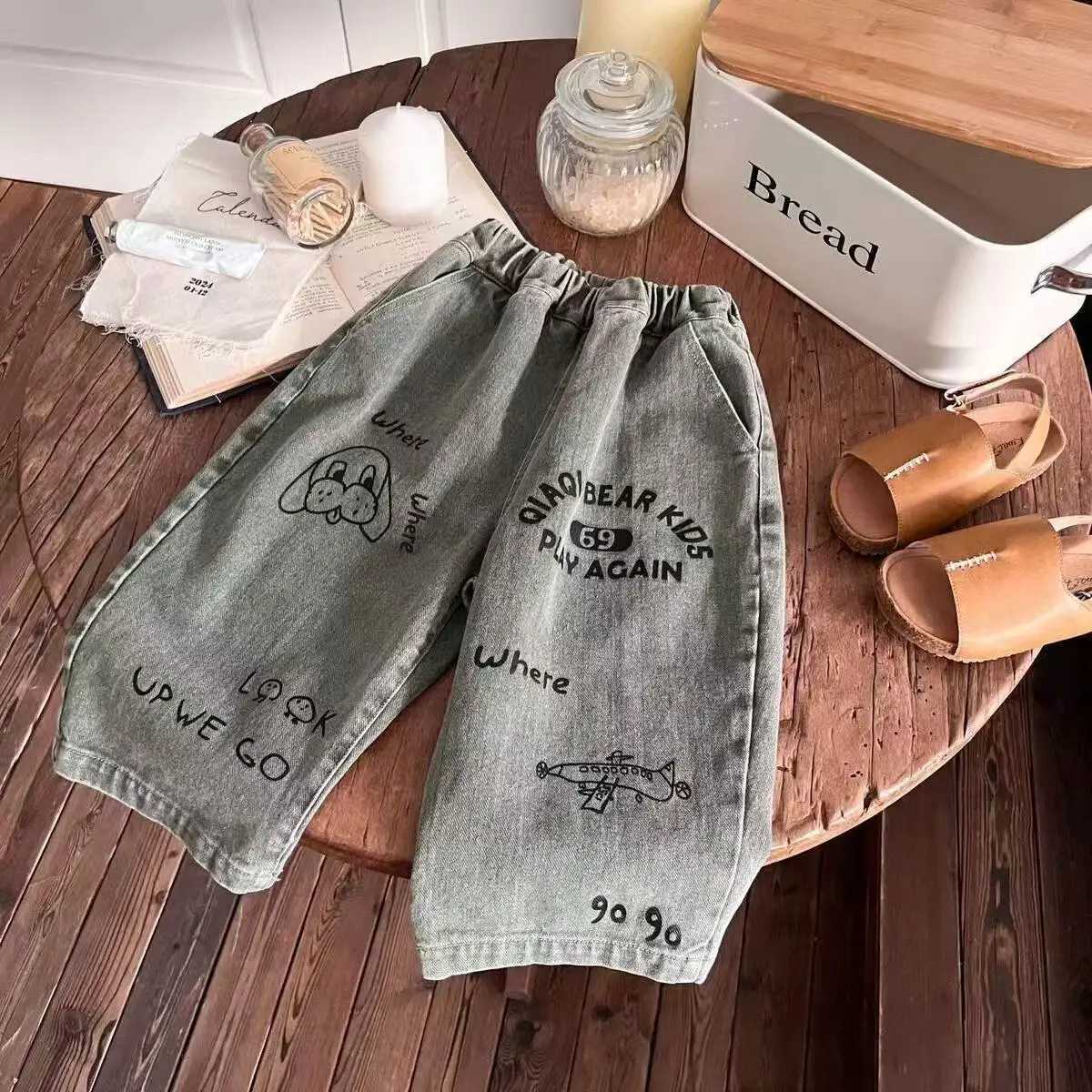 Trousers Spring and Autumn 2025 New Childrens Korean Jeans Boys and Girls Cartoon Printed Graffiti Straight Pants Long PantsT251017