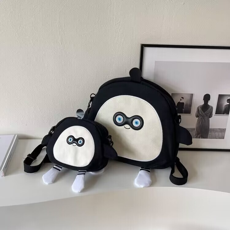 Designer's new fashionable large capacity cartoon canvas bag, cute egg party backpack, casual fashion hot selling small crossbody bag