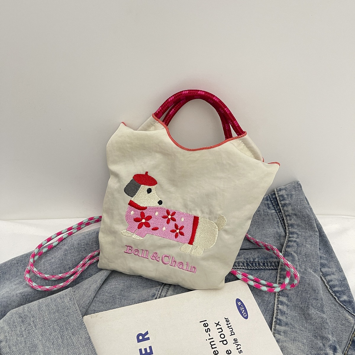 New Korean style designer embroidered cute sausage dog cartoon color blocked women's fashionable handbag multifunctional commuting shoulder bag