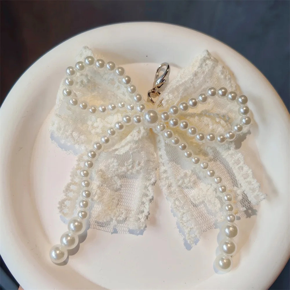 Fashion Lace Pearl Bow Shoelace Buckle Sneakers Decorative Charm Shoe Flower Buckle Womens Bag Pendant Bow Key Chain Accessorie 251013