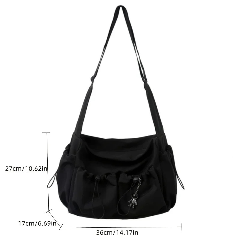 Fashionable Crossbody Bag with Drawstring Accent Spacious Secure Zipper Closure Includes Stylish Bag Charm 251014
