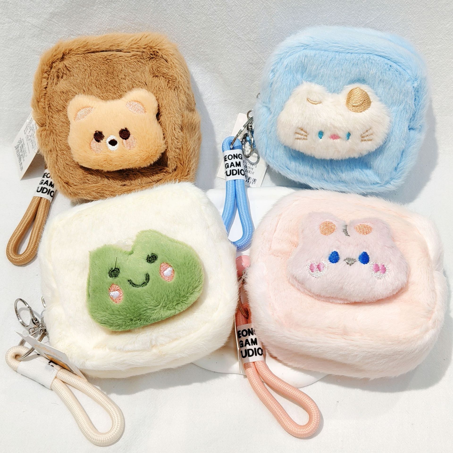 Designer's new cute pet plush coin wallet cartoon cute headphones key storage bag backpack pendant square small plush bag