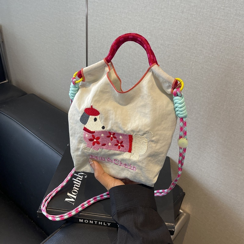 New Korean style designer embroidered cute sausage dog cartoon color blocked women's fashionable handbag multifunctional commuting shoulder bag