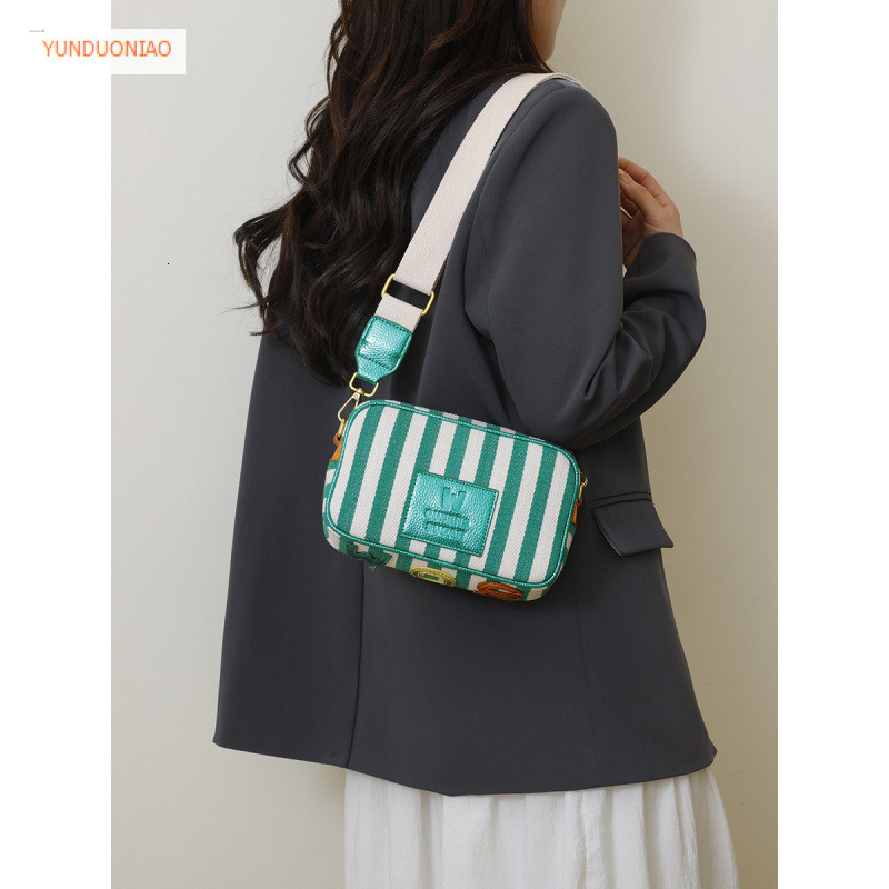 New women's shoulder bag with simple stripes fashionable autumn and winter new designer bag color blocked women's crossbody bag luxury handb
