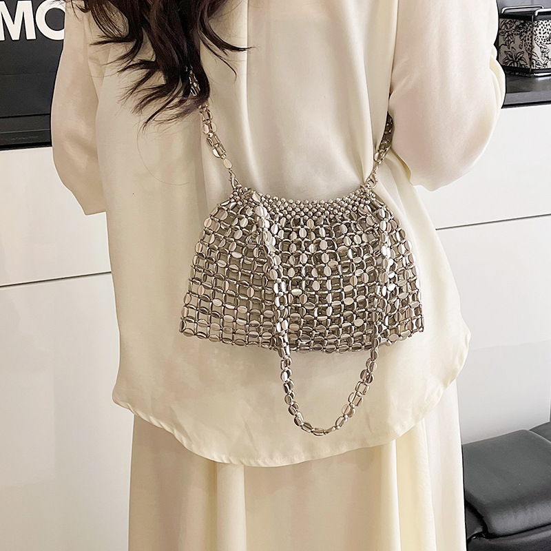 Luxury Brand Designer Bag Luxury Brand Designer Bag French Style Light Luxury Handmade Beaded Woven Shoulder Bag 2025 Summer Metal Design Hollow Versa