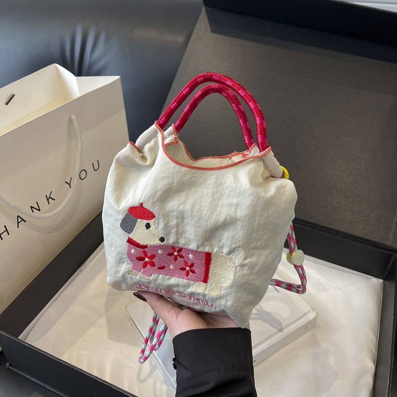 New Korean style designer embroidered cute sausage dog cartoon color blocked women's fashionable handbag multifunctional commuting shoulder bag