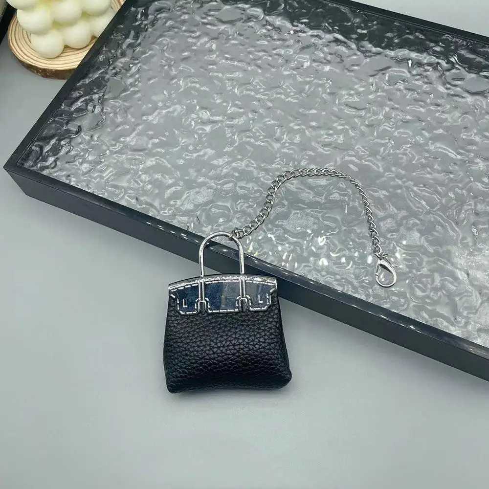 New Mini Bag Hanging Pendant High Quality Leather Car Keychain Hand Rope Small Bag Pendant Keychain Gifts Creative Earphone Bag W251021