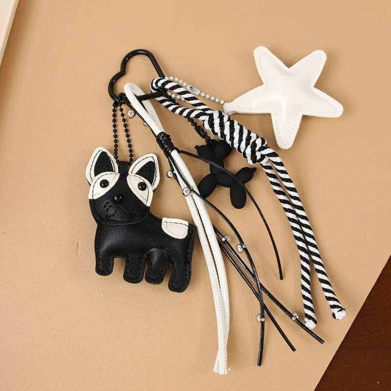 Designer womens bag black white wind cute magic doggie star leather bag pendant niche creative versatile accessories pendant J251121