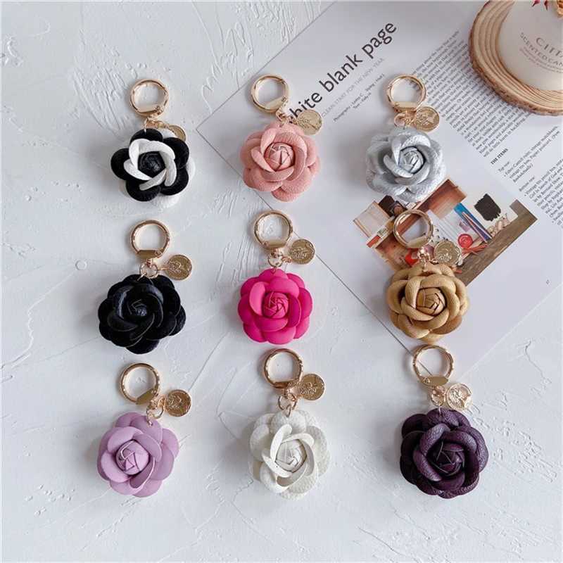 Luxury Black White Camellia Genuine Leather Flower Keychain Letter Umbrella Pendant Car Key Chain Ring Pendant For Bag Accessory W251021