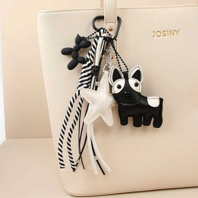 Designer womens bag black white wind cute magic doggie star leather bag pendant niche creative versatile accessories pendant J251121