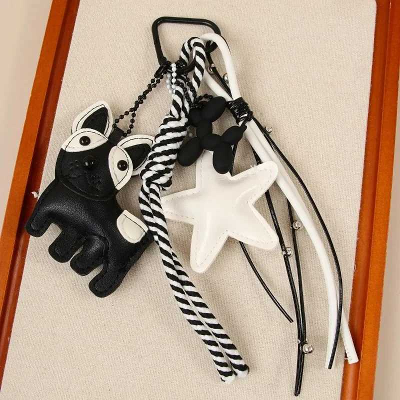 Designer womens bag black white wind cute magic doggie star leather bag pendant niche creative versatile accessories pendant J251121