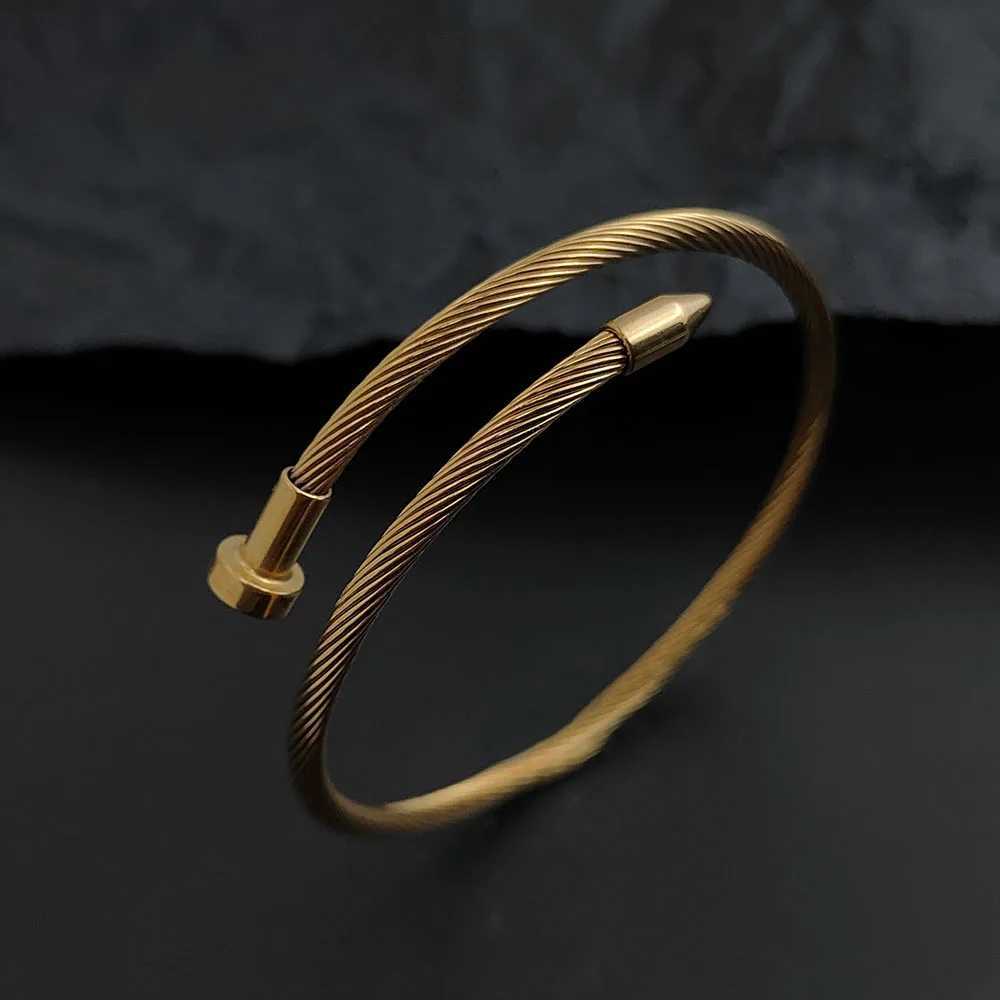 Luxcury Women's Goldtone Silver Finish Water Resistant Nail Design Bangle with Elegant Clasp Detailing