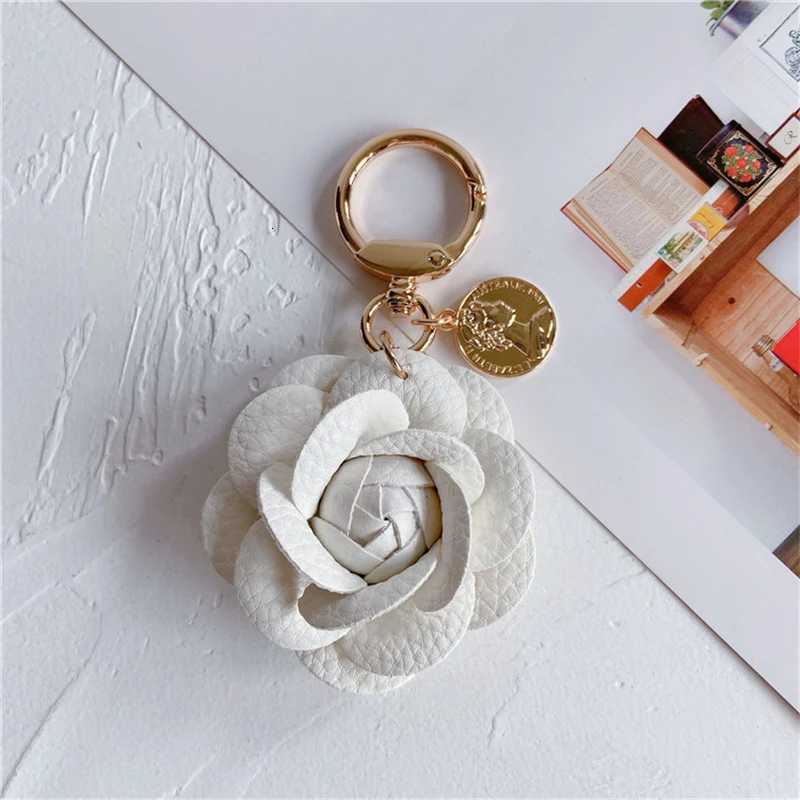 Luxury Black White Camellia Genuine Leather Flower Keychain Letter Umbrella Pendant Car Key Chain Ring Pendant For Bag Accessory W251021