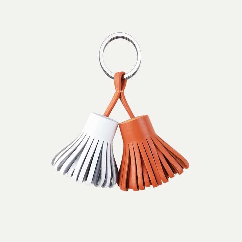 Sheepskin twocolor grass skirt bag pendant 2025 new luxury genuine leather key ring womens handbag tassel hanging decoration J251121