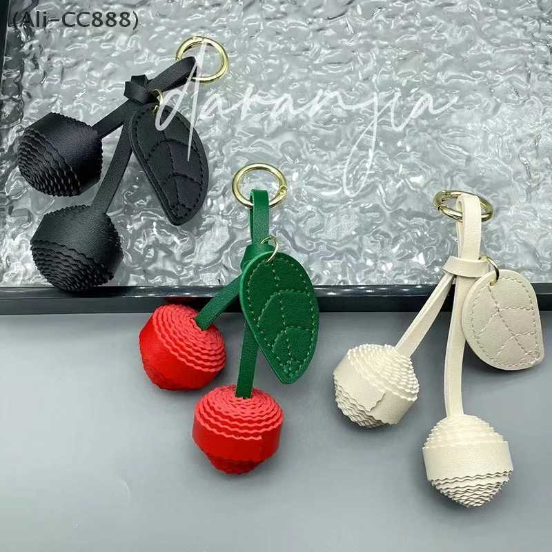 CC88New Leather Leaf Exquisite Cherry Braided Ball Bag Pendant Keychain Womens Bag Decoration Accessories W251021