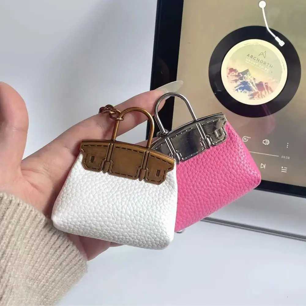 New Mini Bag Hanging Pendant High Quality Leather Car Keychain Hand Rope Small Bag Pendant Keychain Gifts Creative Earphone Bag W251021