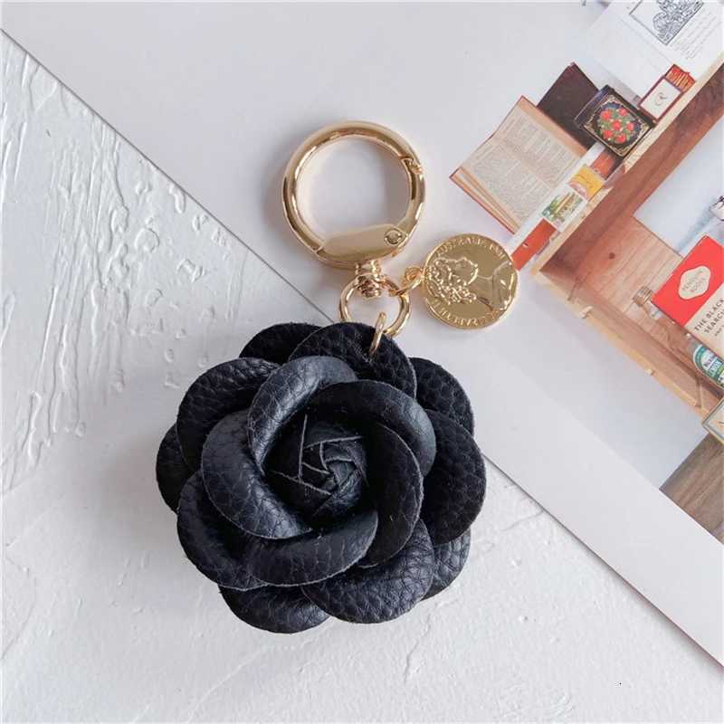 Luxury Black White Camellia Genuine Leather Flower Keychain Letter Umbrella Pendant Car Key Chain Ring Pendant For Bag Accessory W251021