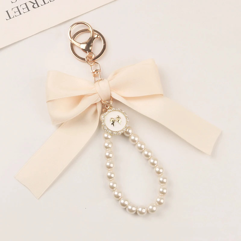 Bowknot Keychains Womens Pearl Chain Big Bow Tie Tote Hanging Ornament Bag Decorations DIY Headphone Case Accessories Kit Chain 251017