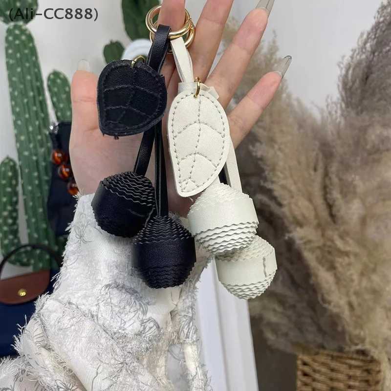 CC88New Leather Leaf Exquisite Cherry Braided Ball Bag Pendant Keychain Womens Bag Decoration Accessories W251021