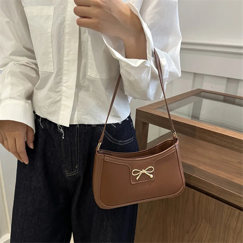 Stylish Shoulder Bag with Metal Bow Decoration Versatile Underarm Bag Classic Brown and Black Baguette Bag for Women Daily Use 251015
