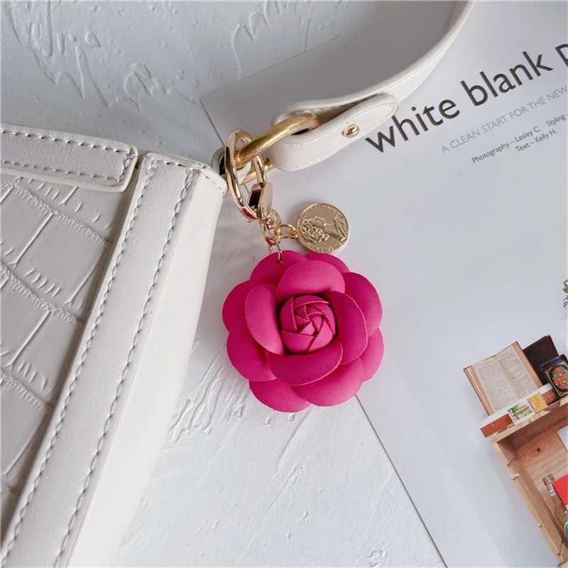 Luxury Black White Camellia Genuine Leather Flower Keychain Letter Umbrella Pendant Car Key Chain Ring Pendant For Bag Accessory W251021