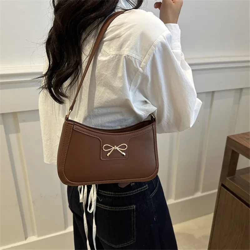 Stylish Shoulder Bag with Metal Bow Decoration Versatile Underarm Bag Classic Brown and Black Baguette Bag for Women Daily Use 251015