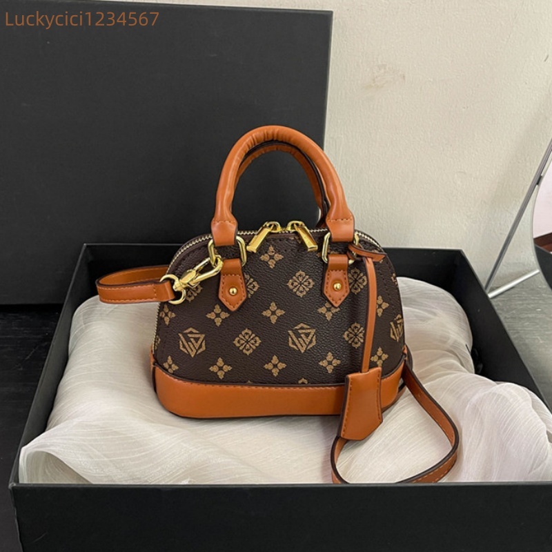 Luxury Bag Designer Bag Fashionable female Advanced printed retro light hand-held vintage flower shell new versatile and temperament crossbody bag sho